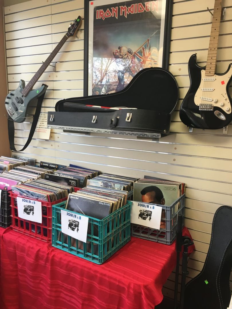 A display of records and guitars.